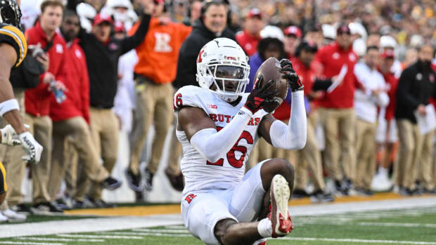 Rutgers Scarlet Knights defensive back Max Melton (16) intercepts a pass from Iowa Hawkeyes quarterback Deacon Hill (not pictured) during the second quarter at Kinnick Stadium